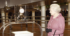 Her Majesty Queen Elizabeth receives a Dent Great Wheel Skeleton clock